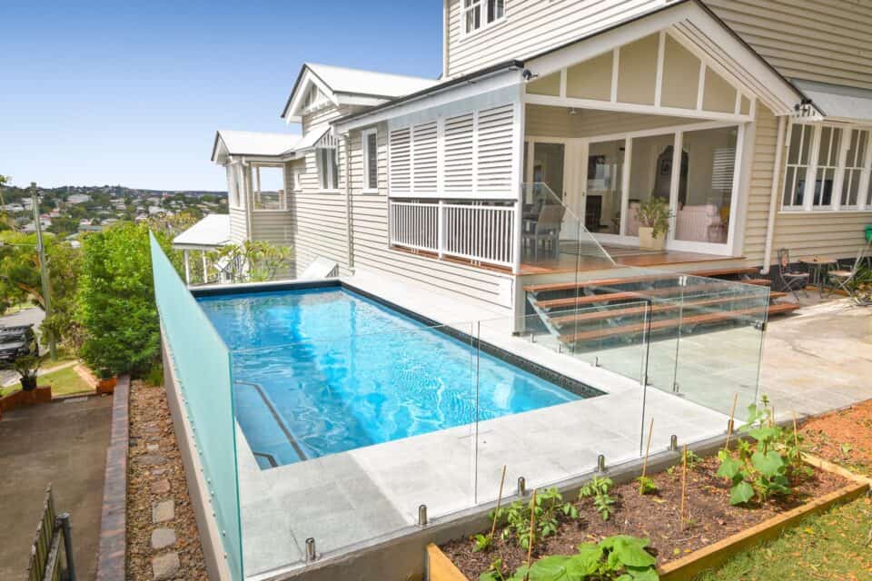 Photo of house and swimming pool that uses Blue Glass Pebbles interior